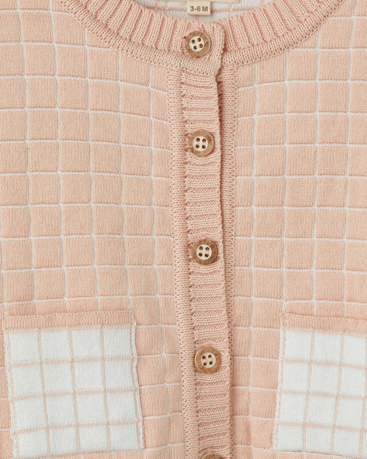 Roze vest met ruitjespatroon